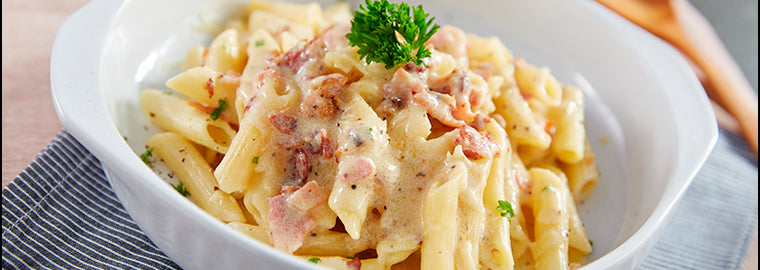 Fettuccini con judías blancas, rúcula y zanahorias